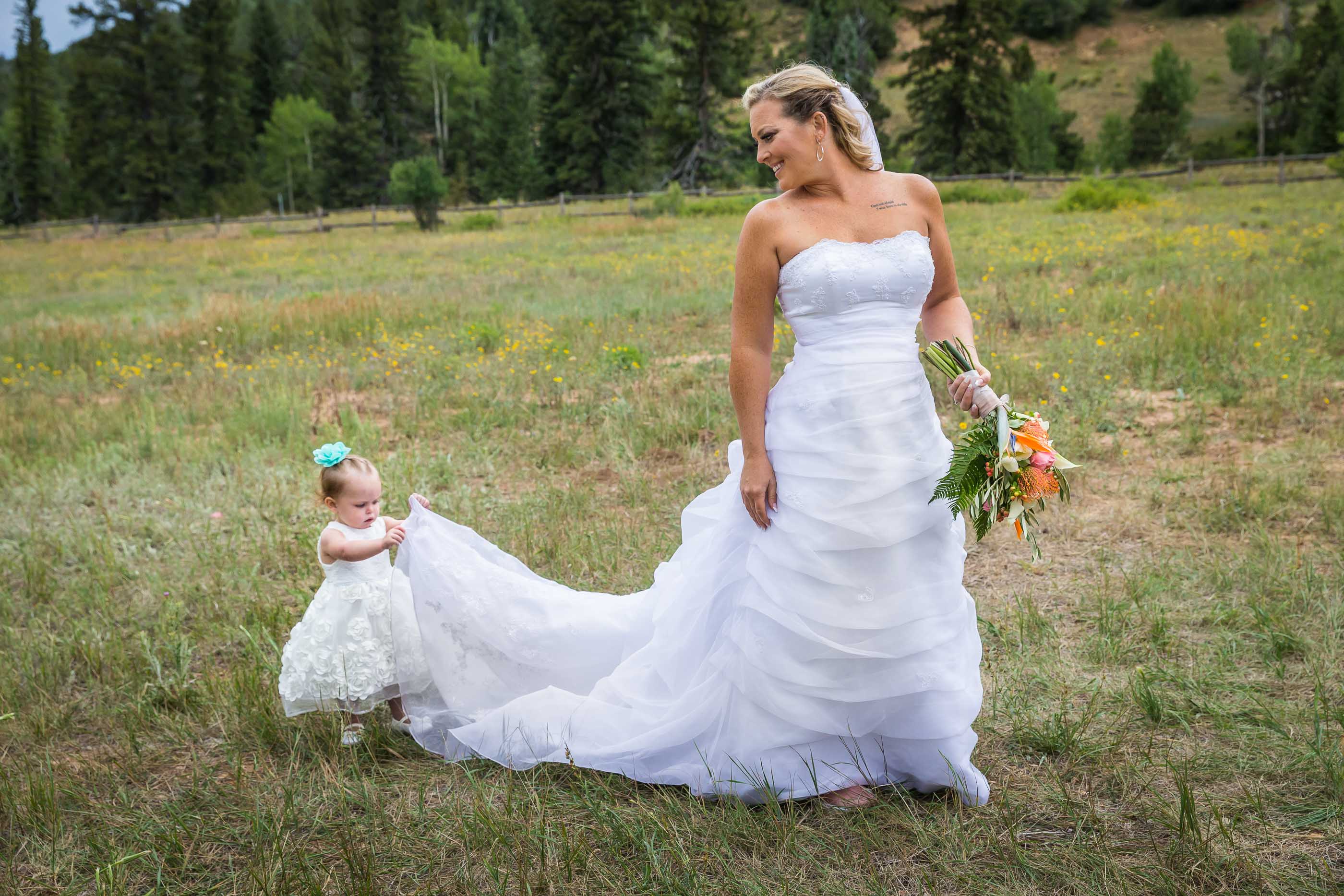 Cedar City Mountain Wedding daughter holding dress