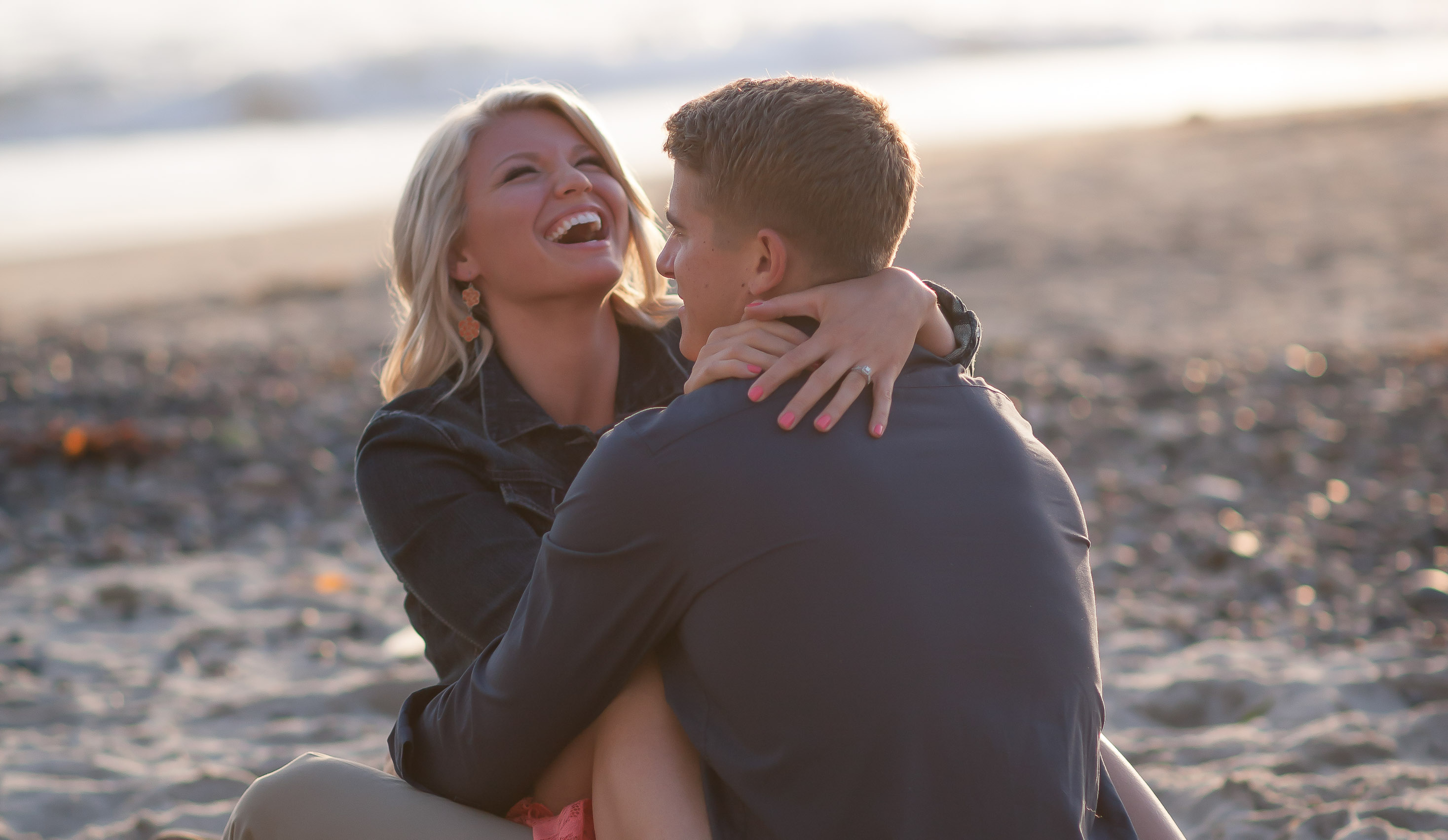 Sensual embrace during Engagement Images on San Clemente Pier Danielle and John Galloup