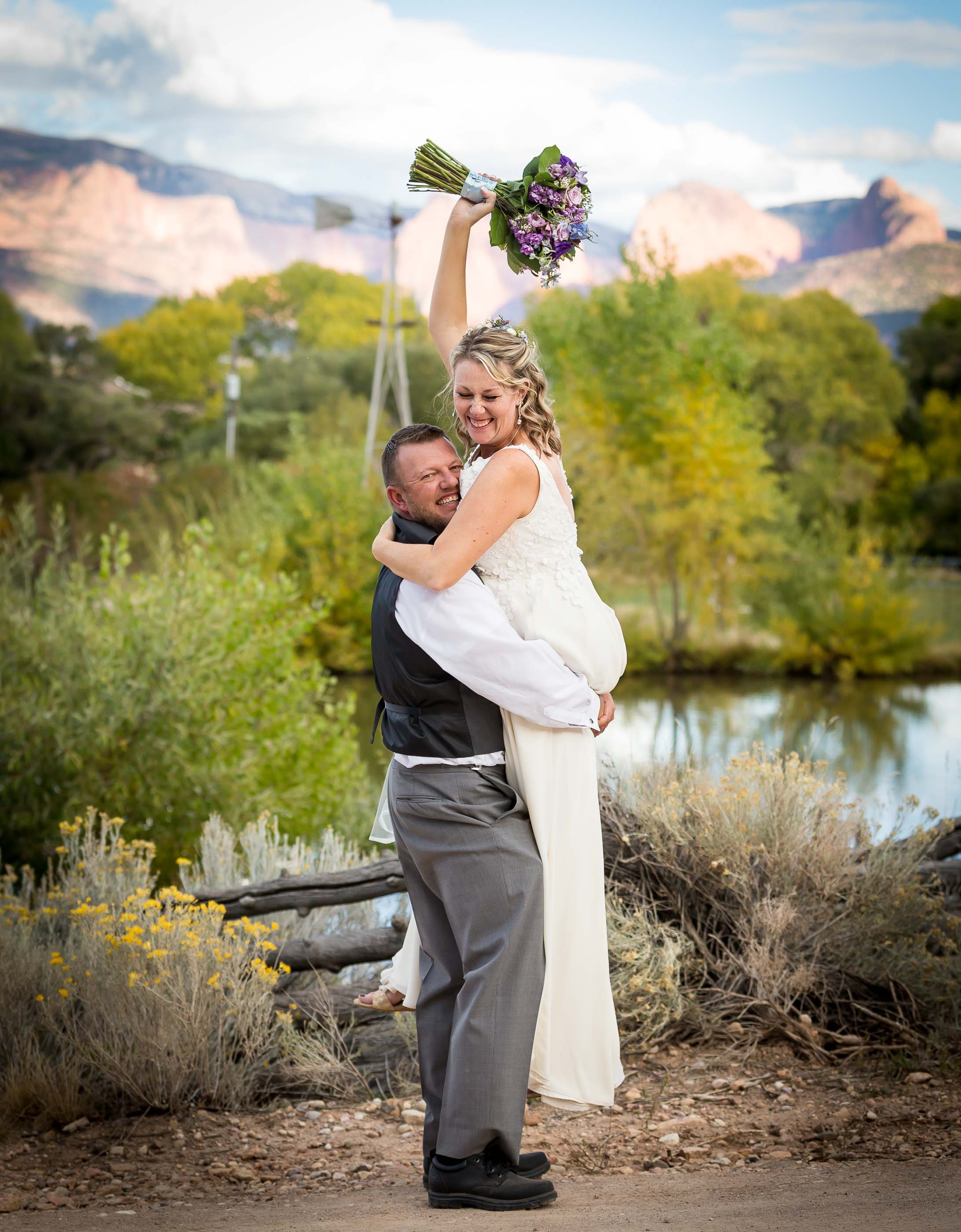 Happy Bride and Groom next to Pond
