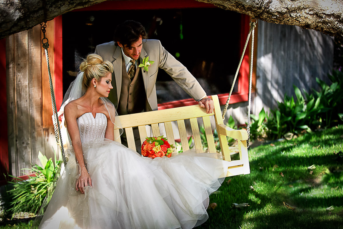 Bride and Groom at the swing Rancho Las Lomas Resort